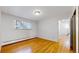 Bright bedroom with hardwood floors and access to hallway at 1056 N Marion St # 204, Denver, CO 80218