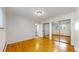 Large bedroom with mirrored closet and hardwood floors at 1056 N Marion St # 204, Denver, CO 80218