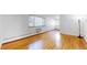 Spacious bedroom with hardwood floors and large window at 1056 N Marion St # 204, Denver, CO 80218