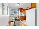 Cozy kitchen features wood cabinets and a dining area at 1056 N Marion St # 204, Denver, CO 80218