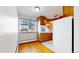 Efficient kitchen with wood cabinets and built-in appliances at 1056 N Marion St # 204, Denver, CO 80218