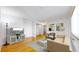 Bright living room with hardwood floors and large windows at 1056 N Marion St # 204, Denver, CO 80218
