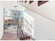 Indoor stairwell with carpeted floors and large window at 1056 N Marion St # 204, Denver, CO 80218