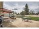 Spacious backyard with a seating area, lawn, and tall mature trees offering plenty of privacy at 3751 W 85Th Ave, Westminster, CO 80031