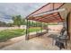 Covered patio with outdoor seating overlooking a spacious backyard with lush green lawn at 3751 W 85Th Ave, Westminster, CO 80031