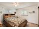 Cozy bedroom featuring a ceiling fan, carpeted floors, and natural light from two windows at 3751 W 85Th Ave, Westminster, CO 80031
