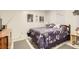 Cozy bedroom with a floral-patterned bedspread and decorative wall art for a relaxing atmosphere at 3751 W 85Th Ave, Westminster, CO 80031