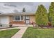 Charming brick home featuring well-manicured lawn and mature landscaping at 3751 W 85Th Ave, Westminster, CO 80031