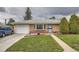 Cozy home with brick facade, green lawn, and attached garage, a welcoming front entrance at 3751 W 85Th Ave, Westminster, CO 80031