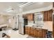 Functional kitchen featuring oak cabinets, white countertops, and modern appliances at 3751 W 85Th Ave, Westminster, CO 80031