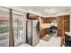 Updated kitchen featuring stainless steel appliances, tile backsplash, and outdoor access at 3751 W 85Th Ave, Westminster, CO 80031