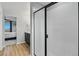 Bright, tiled shower with glass doors in a modern bathroom, connecting to main bedroom at 6513 Dry Fork Cir, Frederick, CO 80516
