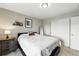 Neutral bedroom featuring carpet, light gray walls, and a closet with sliding doors at 6513 Dry Fork Cir, Frederick, CO 80516