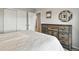 Cozy bedroom featuring carpet, light gray walls, and large closet at 6513 Dry Fork Cir, Frederick, CO 80516
