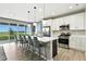 Contemporary kitchen featuring an island, pendant lights, stainless steel appliances, and an open layout at 6513 Dry Fork Cir, Frederick, CO 80516