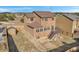 Aerial view of a home featuring a spacious backyard with a wooden fence and a back deck at 861 Circle Rd, Palmer Lake, CO 80133