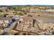 Aerial view of a home featuring a spacious backyard with a wooden fence and patio at 861 Circle Rd, Palmer Lake, CO 80133