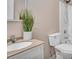 Bathroom featuring a white vanity with cream countertop, toilet, and shower at 861 Circle Rd, Palmer Lake, CO 80133