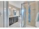 Bathroom features double sinks, a large bathtub and a glass shower at 861 Circle Rd, Palmer Lake, CO 80133