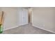 Bedroom featuring neutral carpet, and a closet with white bi-fold doors at 861 Circle Rd, Palmer Lake, CO 80133