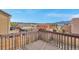 View from an upper deck looking out over the neighboring houses and a distant mountain range at 861 Circle Rd, Palmer Lake, CO 80133