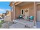 A cozy front porch features seasonal decorations and seating at 861 Circle Rd, Palmer Lake, CO 80133