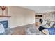 Inviting living room features a stone fireplace, hardwood floors, and an open floor plan to the kitchen at 861 Circle Rd, Palmer Lake, CO 80133