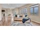 Bright living room with large windows, hardwood floors, and comfortable seating area at 861 Circle Rd, Palmer Lake, CO 80133