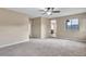 Large main bedroom with neutral walls, carpet floors and open entryway at 861 Circle Rd, Palmer Lake, CO 80133