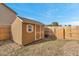 A wooden shed sits in a fenced in backyard at 861 Circle Rd, Palmer Lake, CO 80133