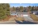 Aerial view of a single-Gathering home with mature trees, landscaping, and a two-car garage at 7110 S Cherry Dr, Centennial, CO 80122