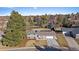 Aerial view of a single-Gathering home with mature trees, landscaping, and a two-car garage at 7110 S Cherry Dr, Centennial, CO 80122