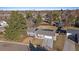 Aerial view of a single-Gathering home with mature trees, landscaping, and a two-car garage at 7110 S Cherry Dr, Centennial, CO 80122