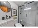 Modern bathroom featuring a glass-enclosed shower and sleek fixtures at 7110 S Cherry Dr, Centennial, CO 80122