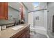 Bright bathroom with a skylight, subway tile, and modern fixtures at 7110 S Cherry Dr, Centennial, CO 80122