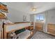 Charming bedroom featuring bunk beds, wood accents, and a sunny window at 7110 S Cherry Dr, Centennial, CO 80122