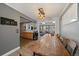 A farmhouse dining table with views to living space and kitchen at 7110 S Cherry Dr, Centennial, CO 80122