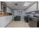 Functional laundry room with ample storage and modern appliances at 7110 S Cherry Dr, Centennial, CO 80122