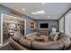 Spacious living room with skylight, comfortable seating, and seamless flow into the kitchen at 7110 S Cherry Dr, Centennial, CO 80122