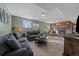 Comfortable living room with brick fireplace and plush seating at 7110 S Cherry Dr, Centennial, CO 80122