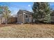 Exterior view of a backyard shed, including a light fixture above the door at 7110 S Cherry Dr, Centennial, CO 80122