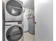 Laundry area with stackable washer and dryer at 6410 S Dayton St # I05, Englewood, CO 80111