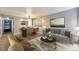 Cozy living room with dining area, neutral paint, stylish furniture and decor creating a modern yet comfortable space at 6410 S Dayton St # I05, Englewood, CO 80111