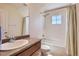 Well-lit bathroom featuring a shower-tub, single sink vanity, and neutral design at 3752 Red Deer Trl, Broomfield, CO 80020