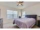 Cozy bedroom with natural light, carpet flooring, and a ceiling fan with lighting at 3752 Red Deer Trl, Broomfield, CO 80020