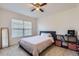 Bright bedroom with carpet flooring, a large window, and a modern storage unit at 3752 Red Deer Trl, Broomfield, CO 80020