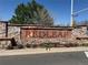 Stone community sign for Redleaf on a clear day, showcasing the neighborhood entrance at 3752 Red Deer Trl, Broomfield, CO 80020