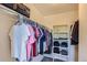 Organized walk-in closet featuring hanging clothes, shelving, and overhead storage at 3752 Red Deer Trl, Broomfield, CO 80020