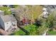 Backyard aerial view featuring a deck, covered patio, hammock, and green lawn at 5997 S Yakima St, Aurora, CO 80015