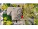 Birds-eye view of a home's roof and backyard with a red patio umbrella at 5997 S Yakima St, Aurora, CO 80015